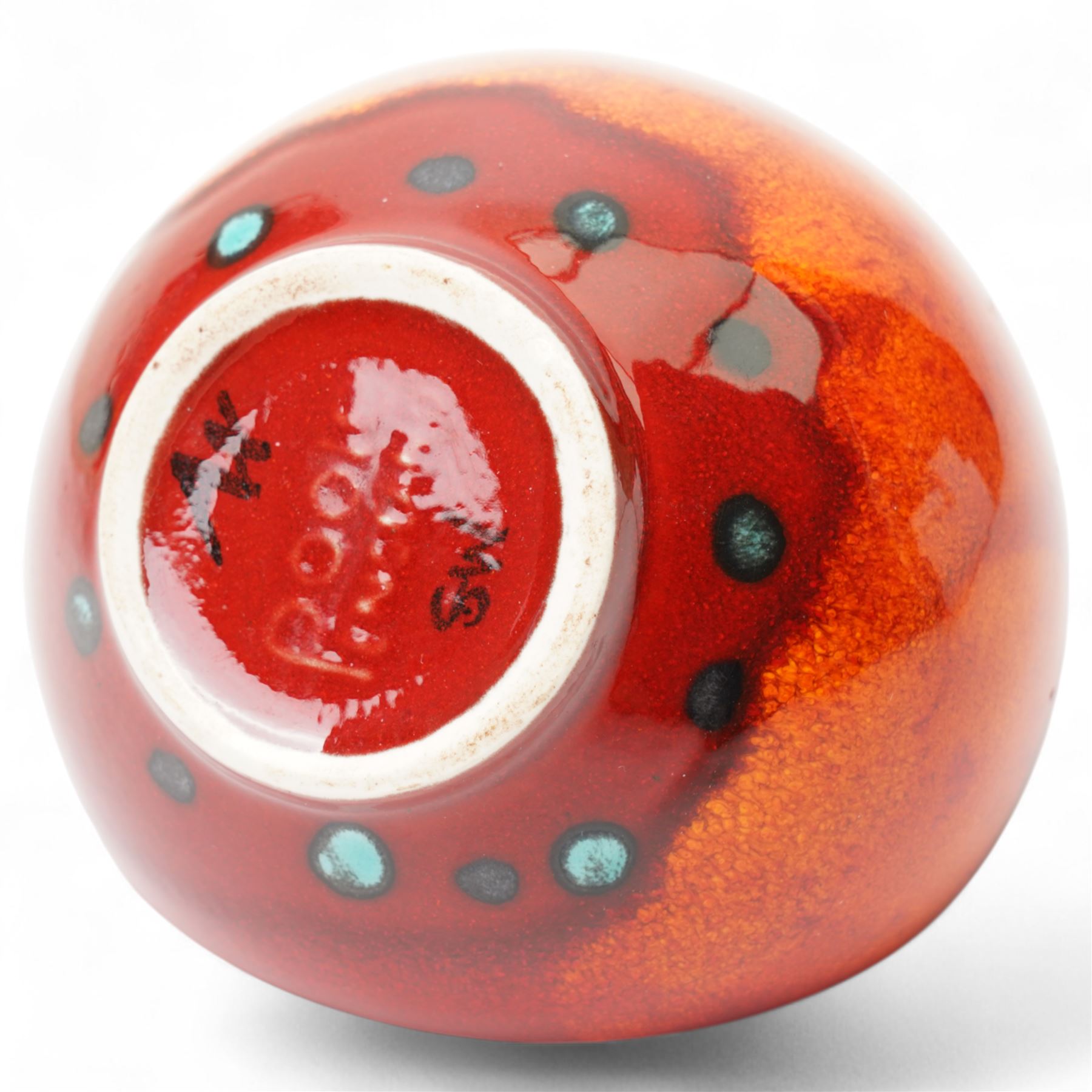 Four Poole pottery 'Volcano' pattern items comprising charger