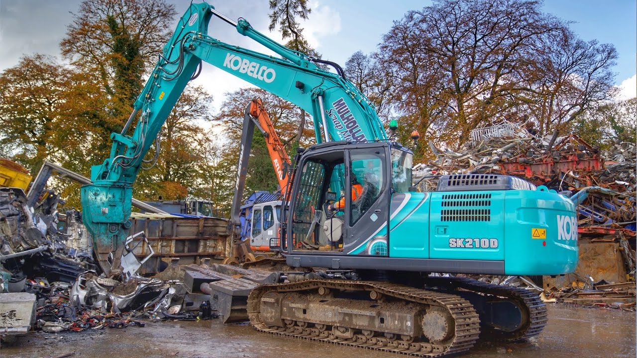 Breaking Cars with the Kobelco SK210D - YouTube