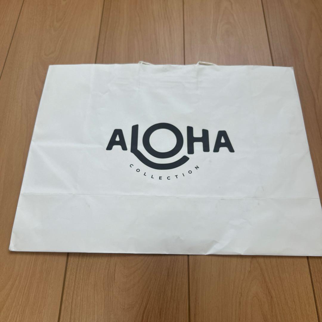 新品　Aloha Collection ハローキティ クラッチバッグ