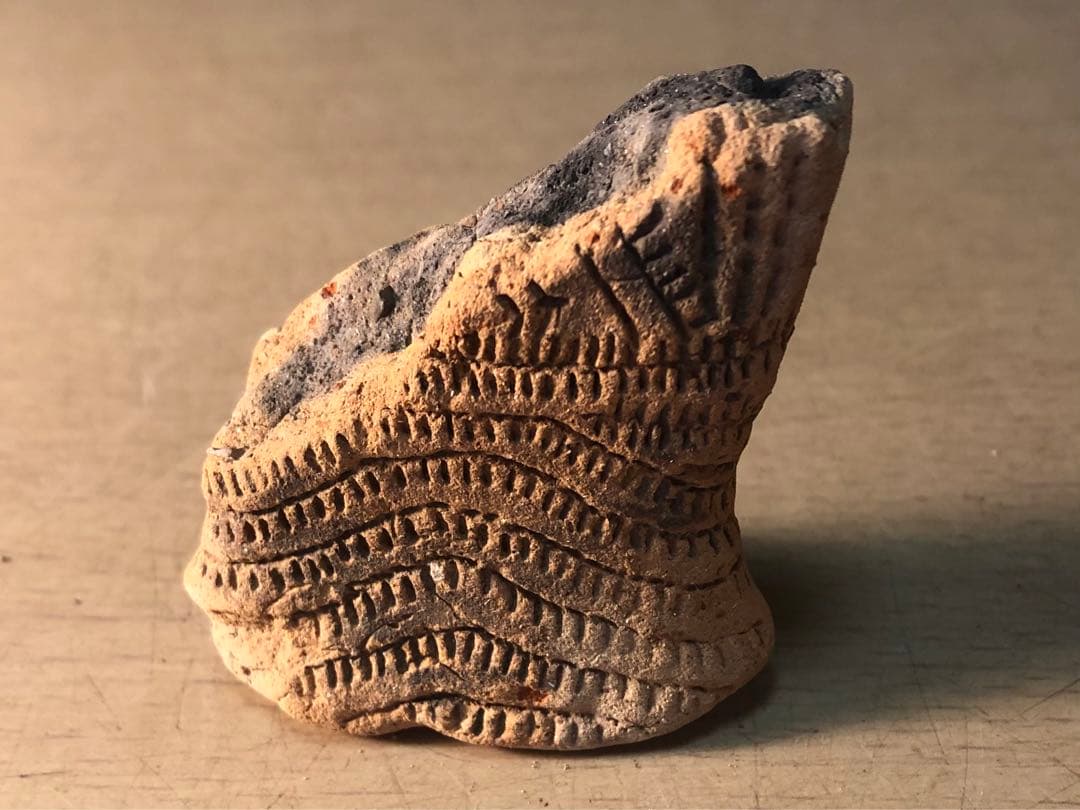 板状土偶の破片」です。