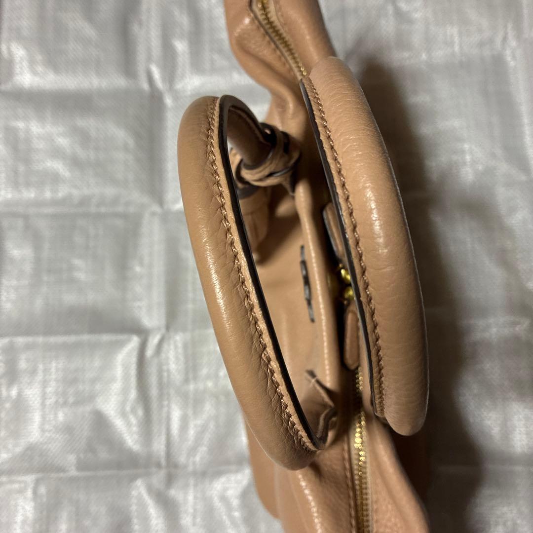 くまちゃんToryBurchピンクベージュハンドバッグタッセル付き